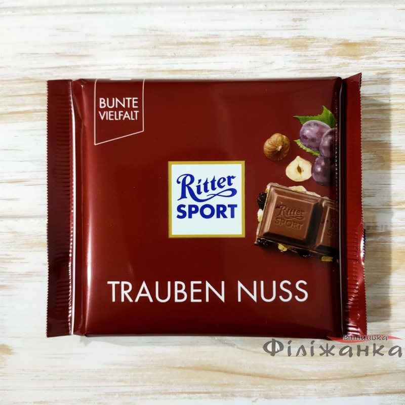 Молочний шоколад з подрібненим фундуком та родзинками Ritter Sport Trauben Nuss 100 г (57567)